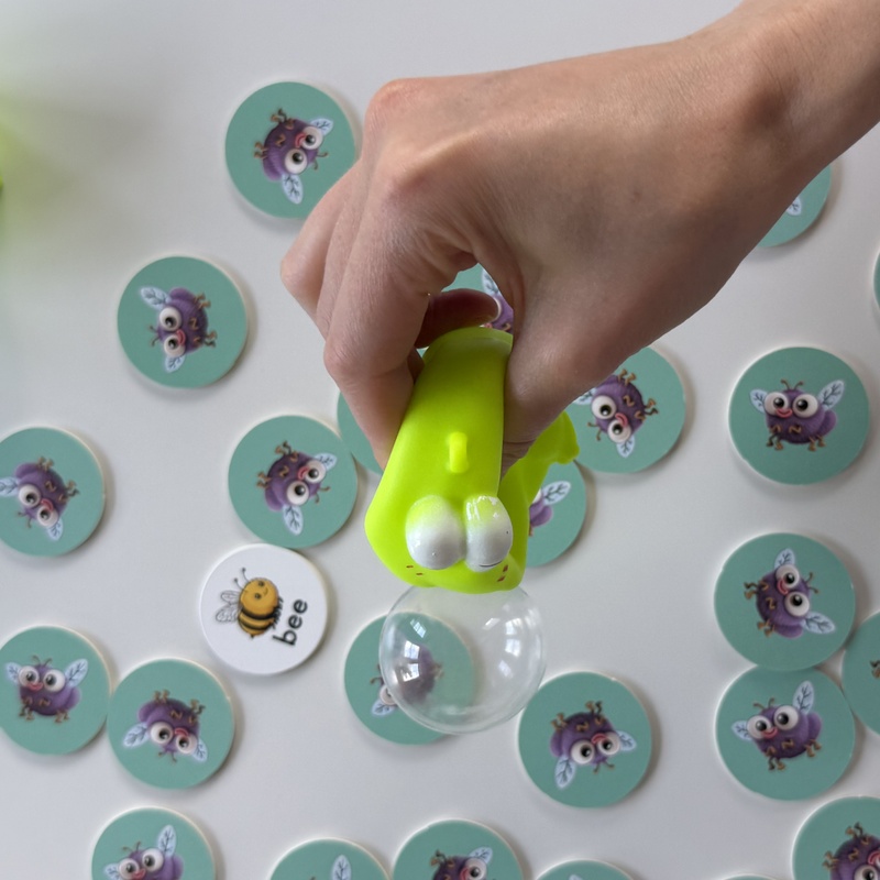 Squish! Squeeze your frog until its sticky bubble appears.